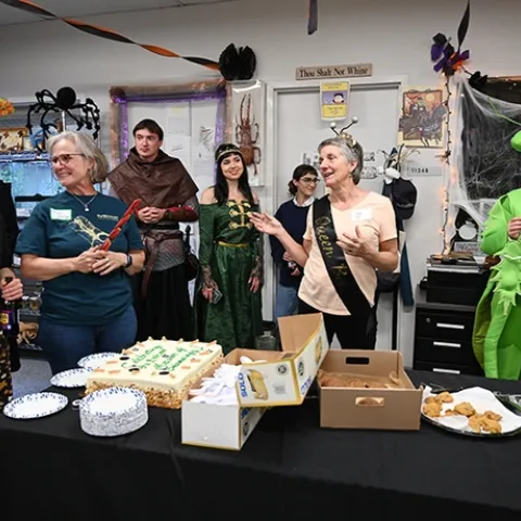 UC Davis distinguished professor Lynn Kimsey (center), director of the Bohart Museum of Entomology, thanks UC Davis biology lab manager and UC Davis alumna Ivana Li (far left), who catered the party. Also pictured (from left) Professor Fran Keller of Folsom Lake College, postdoctoral researcher Severyn Korneyev and his wife, artist Kristina Kernytska, UC Davis alumna Brittany Kohler and Tabatha Yang, Bohart education and outreach coordinator. (Photo by Kathy Keatley Garvey)