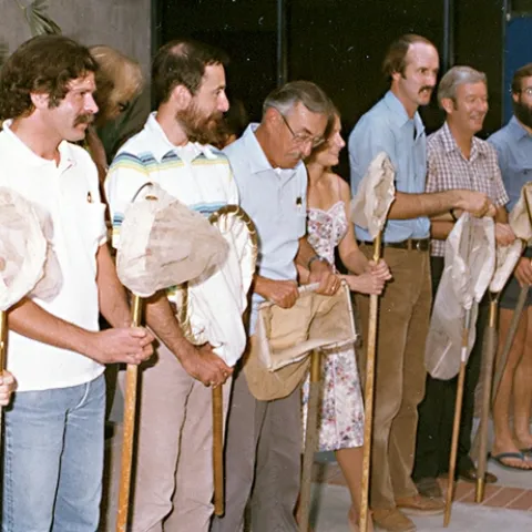 The 21-Insect Net Salute! From left are Lynn Kimsey (partially obscured) David Moody, then a researcher in the Bruce Hammock lab; Bruce Hammock, now a UC Davis distinguished professor; insect ecologist Richard “Dick” Rice (1937-2011); mosquito researcher Debbie Dritz, now a vector ecologist, Sacramento-Yolo Mosquito and Vector Control; agricultural entomologist Les Ehler (1946-2016); apiculturist Norm Gary, now UC Davis professor emeritus; and ant specialist Phil Ward, now an entomology professor.
