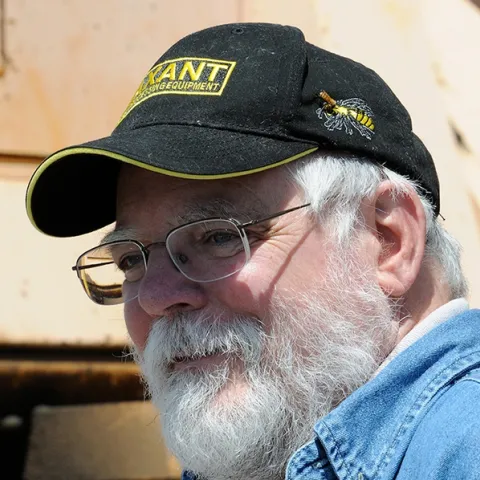 This image of Kim Flottum, taken May 20, 2010 at UC Davis, shows a live bee next to his bee pin. (Photo by Kathy Keatley Garvey)