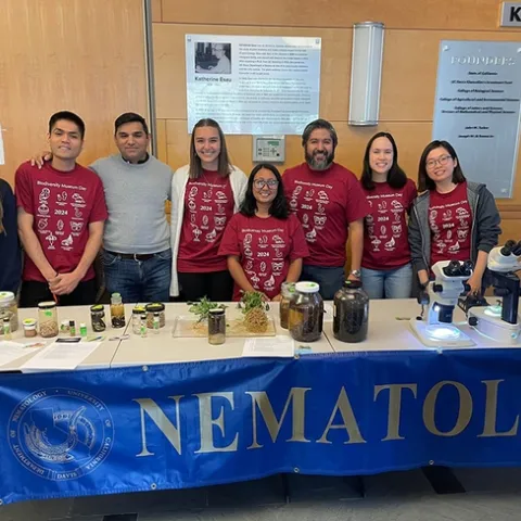 Ready to greet the crowds are (from left) Emma Kraft, undergraduate intern; Nick Latina, doctoral student, Plant Pathology; Shahid Siddique, associate professor and principal investigator; Alison Blundell, doctoral candidate, Plant Pathology; Pallavi Shakya, doctoral candidate, Plant Pathology; Bardo Castro, postdoctoral fellow; Veronica Casey, doctoral student, Entomology; and Ching-Jung Lin, doctoral candidate, Plant Pathology. (Photo courtesy of the Siddique lab)