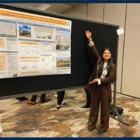 Master's student Erika Escalona shows off her first-place poster presentation during the 2024 California Plant and Soil Conference, hosted by UC ANR in Fresno, Calif., recently.
