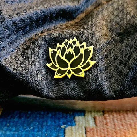 Lotus flower pin on hat - P. Pashby