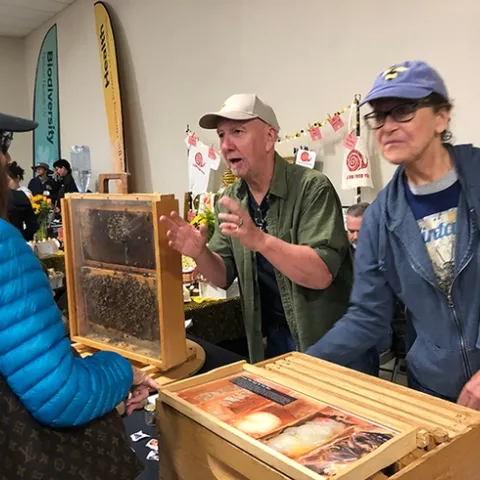 Beekeepers Rick Moehrke and Casey Scott of the Sacramento Area Beekeepers' Association answer questions from attendees at the California Honey Festival. (Photo by Kathy Keatley Garvey)