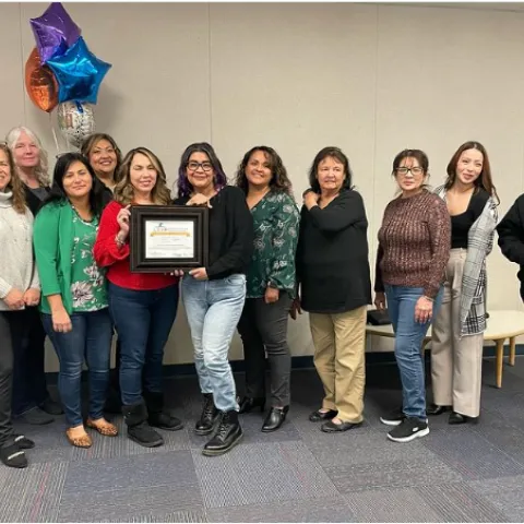 Child Development Center staff hold LEAP Award