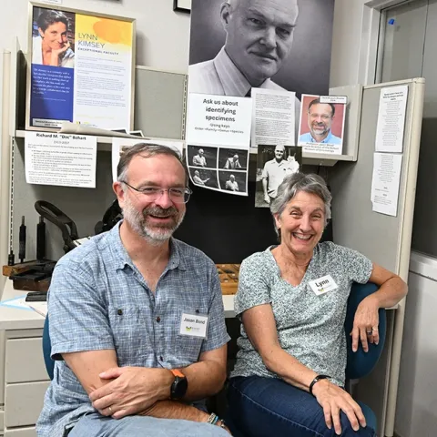 Only three directors have led the Bohart Museum of Entomology since 1946. Pictured are hymenopterist Lynn Kimsey, director from 1990 to Feb. 1, 2024, and arachnologist Jason Bond, director since Feb. 1. The portrait shows Richard "Doc" Bohart, who founded the insect museum in 1946. (Photo by Kathy Keatley Garvey)