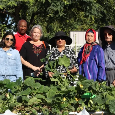 Shital Parikh (left) and a few of the residents that help maintain the Belden Community Garden. Photo by Saoimanu Sope.