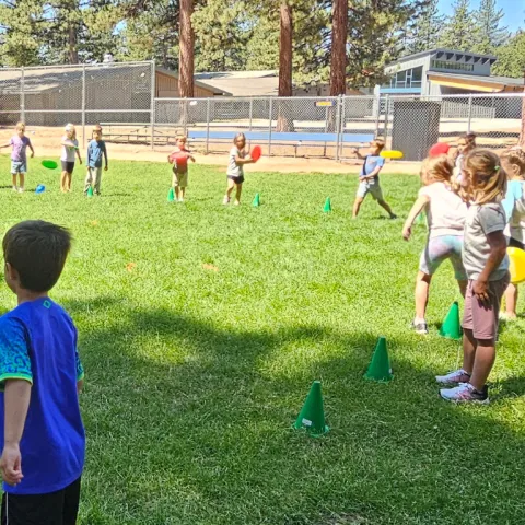 Children playing a frisbee game.