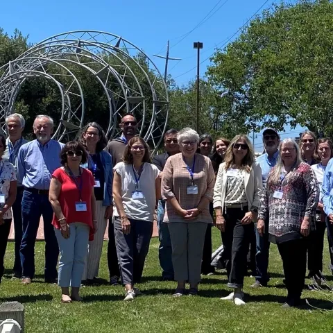 Group photo of Program Council standing on grass