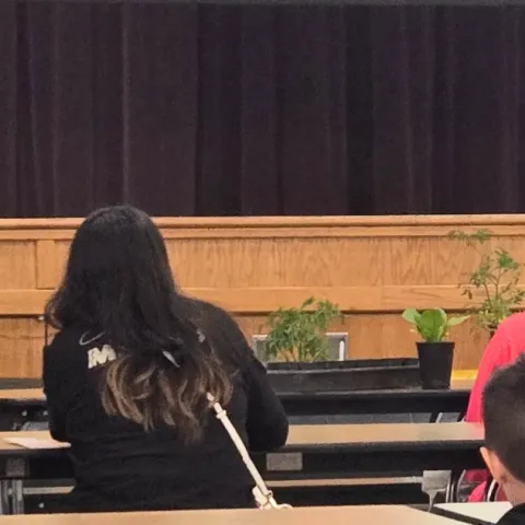 students listening to a teacher