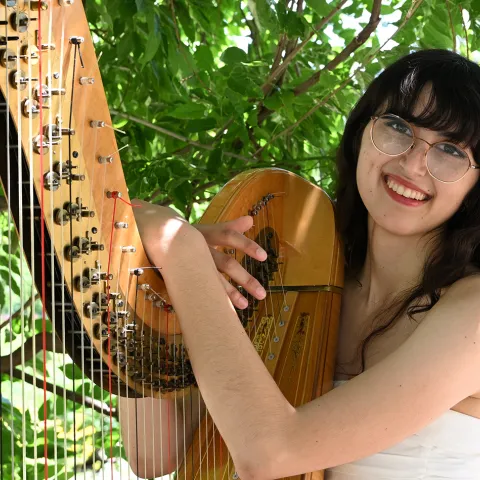 Harpist Samantha Murray, garden coordinator of the UC Davis Bee Haven. (Photo by Kathy Keatley Garvey)