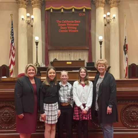 (L to R) are Colleen Delahanty (Turlock Eagles community club leader), Jayna, Josiah, Ava (another project member), and their Story Writing Project leader, Sheila Amaral.