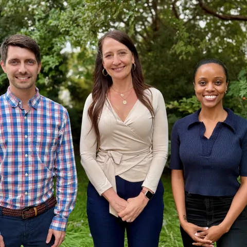 Orry Pratt, Carrie Teiken and Crystal Whitelaw standing side-by-side outdoors.