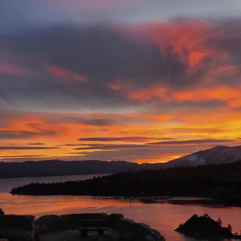 Sunset lake view within a mountain range.