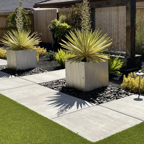 a landscape designed with hardscaping and plants is very streamlined and clean