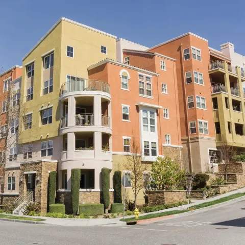 Pink and yellow apartment complex