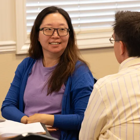 Participants engaged in a small-group discussion during a VINE Build workshop.