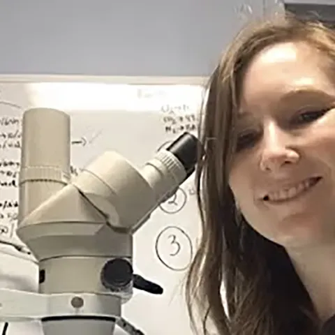 Addie Abrams at the microscope