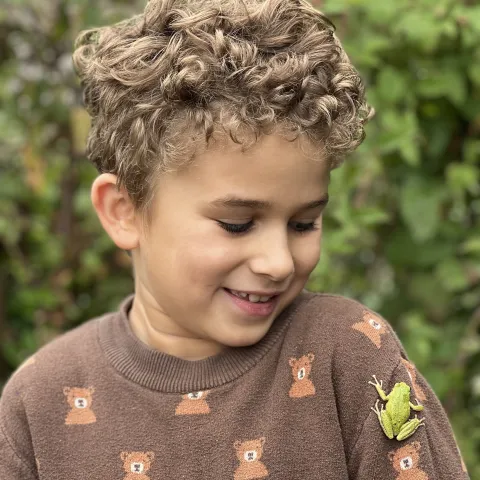 Child with a frog