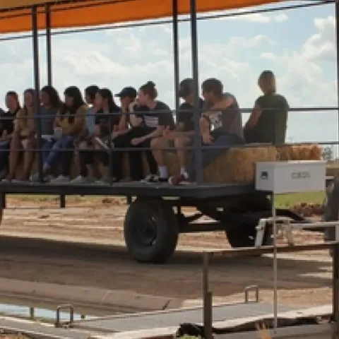 several people riding the farm cart during Farm Smart celebration