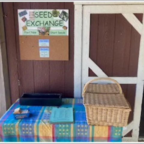 Picure of an event table promoting seed sharing.