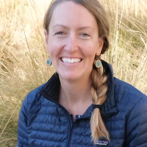 Profile photo of woman with blonde hair in a braid