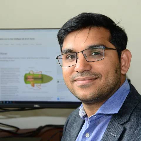 Shahid Siddique, nematologist, smiles at the camera. 