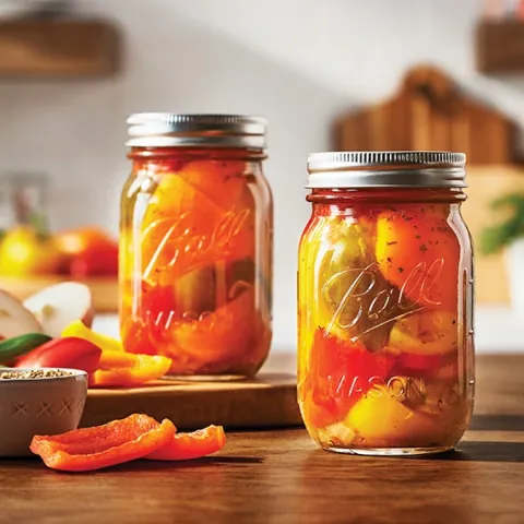 mixed hot peppers in jars