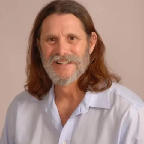 A smiling Master Gardener in a light blue shirt.