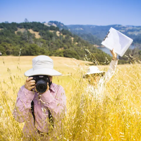 SFREC Researchers in the Field facing the camera with their camera