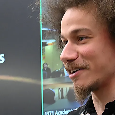 UC Davis doctoral candidate Christofer Brothers discussing dragonflies at Bohart Museum of Entomology open house.