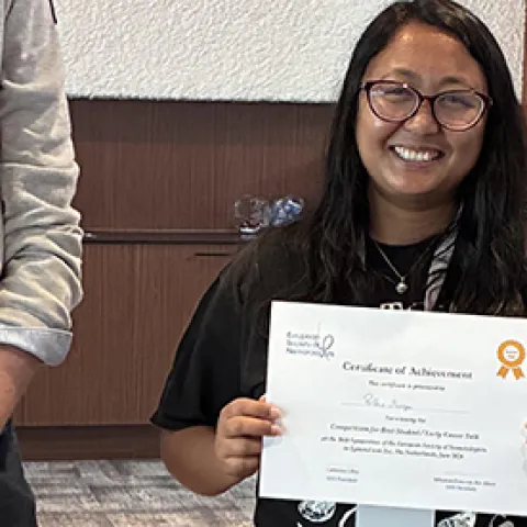 Pallavi Shakya holding award: first-place winner of “Best Student/Early Career Talk” at the 36th Symposium of the European Society of Nematologists