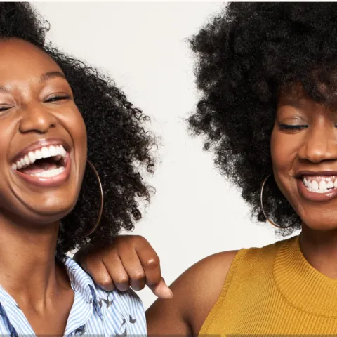 Two people smiling