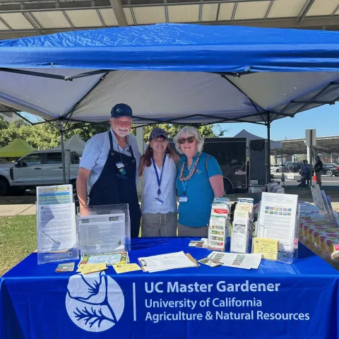 Master Gardeners in their Kiosk at the Visalia Farmers Market