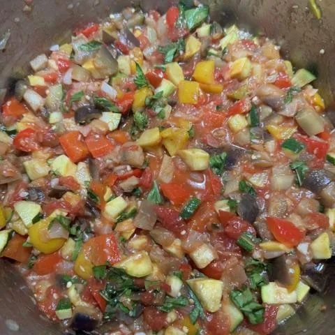 Ratatouille simmering in a pot stainless steel pot
