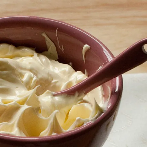 Whipped butter in bowl with spoon.