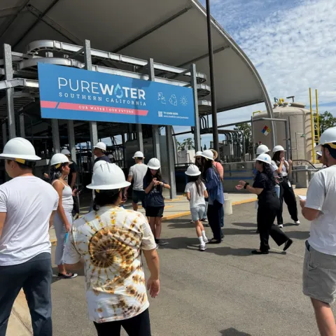 Tour participants walking through the entrance of the Pure Water Southern California Innovation Center.