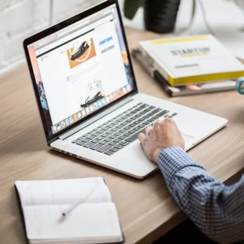 person on a computer at a desk