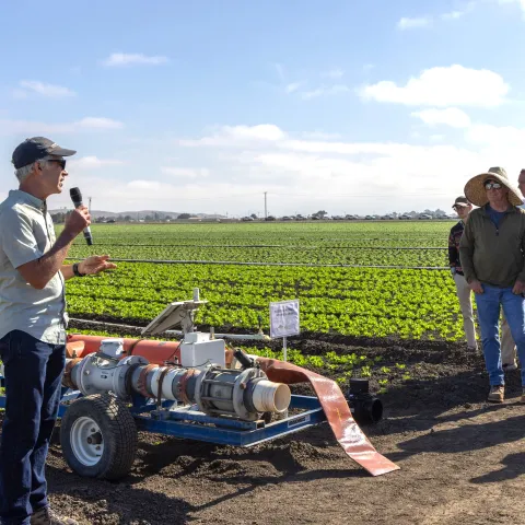 A field-day presenter explains irrigation technology to growers and agricultural professionals during UC ANR Innovate's Coastal Veg Field Day