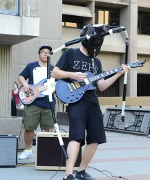 Rhythm guitarist Jackson Audley (front) portrayed an Asian longhorned beetle, Anoplophora glabripennis. In back is bass guitarist Wei Lin , dressed as a Lepisma saccharina, a small wingless insect. Audley studies forest insects with major professor Steve Seybold, and Lin studies honey bees with major professor Brian Johnson. (Photo by Kathy Keatley Garvey)