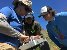 Preparing ground penetrating radar in the field. Photo by Noah Lyman.
