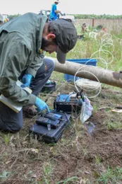 Sampling properties of the well water. Photo by Meredith Goebel.