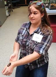 Bohart associate Emma Cluff with Madagascar hissing cockroaches. (Photo by Kathy Keatley Garvey)