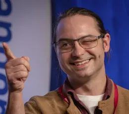 Doctoral candidate Brendon Boudinot smiles as he answers a question at last year's championship round.