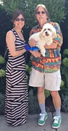 The family: Mike and Grace with their dog, Murphy, a Coton de Tulear. Murphy passed in April 2020.