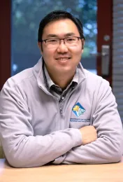 Danny is wearing a jacket sporting the UC Master Gardener logo.