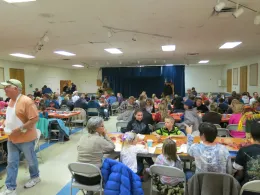 People seated in a banquet hall.