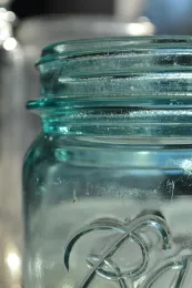 edge of a blue Ball canning jar
