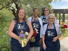 Graduating MFP Class of 2025 four women standing in beautiful landscape