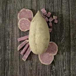 Whole white-skinned sweet potato with slices of light purple flesh arranged around it