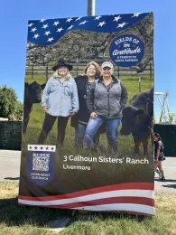 Banner of three women ranchers with black cows behind them. 